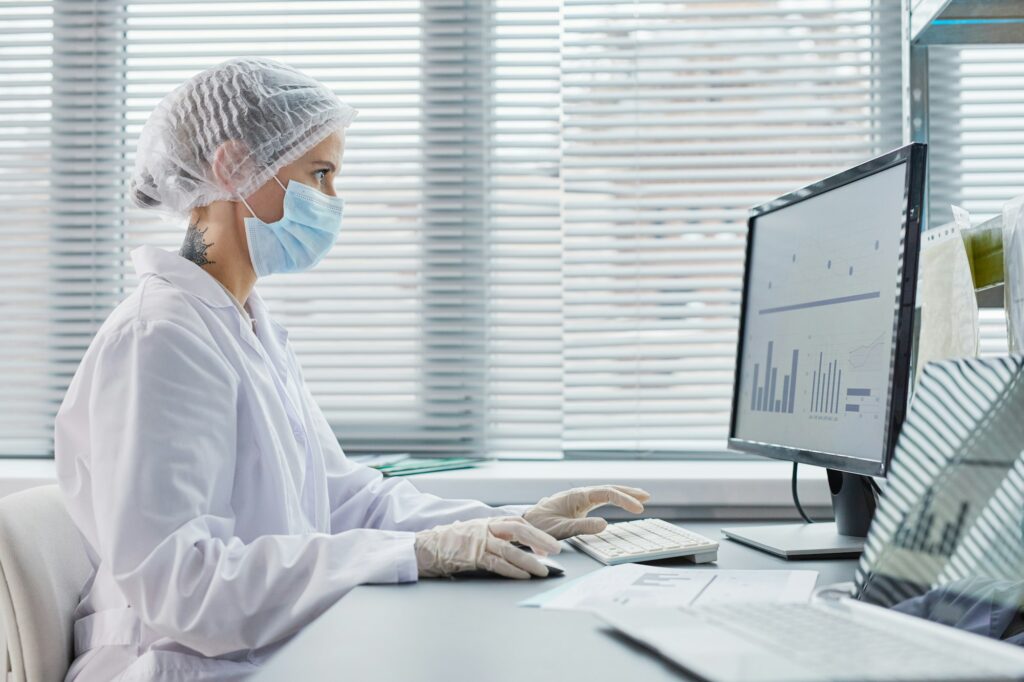 Doctor working on computer at office